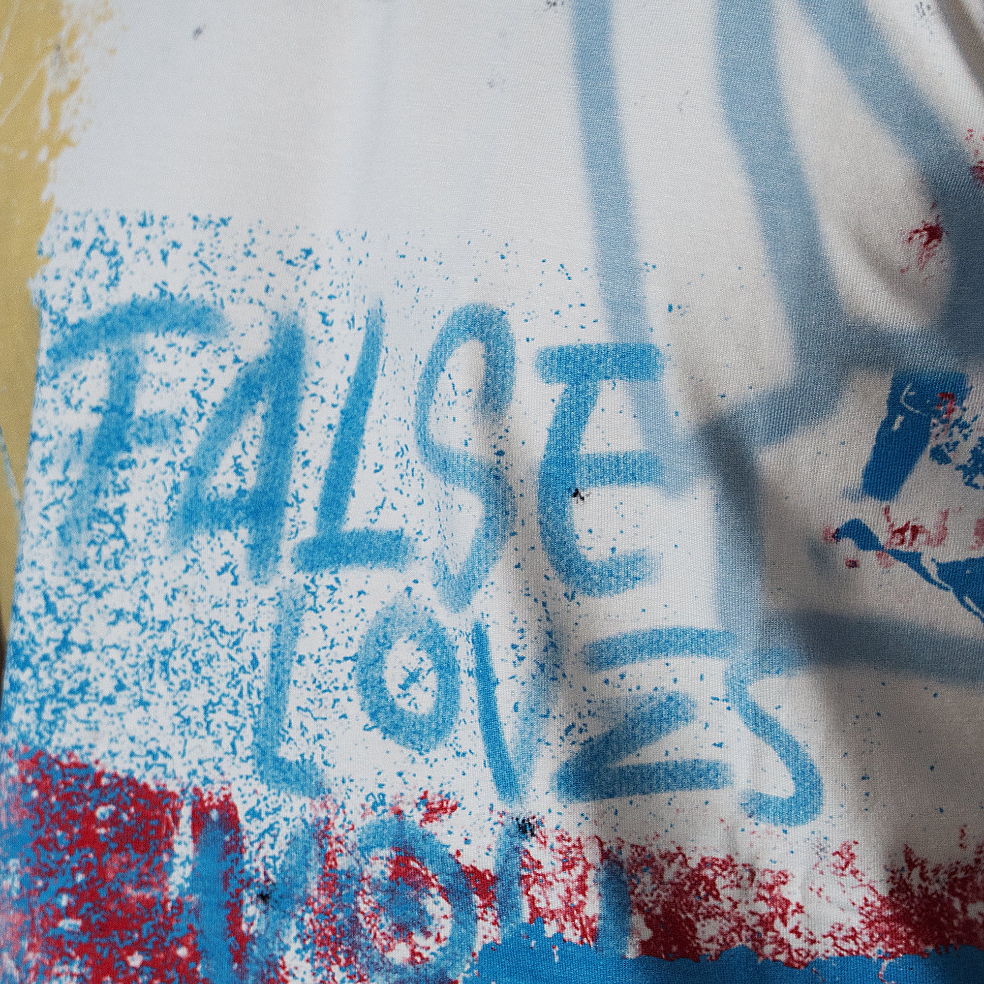 False spray graffiti baby tee